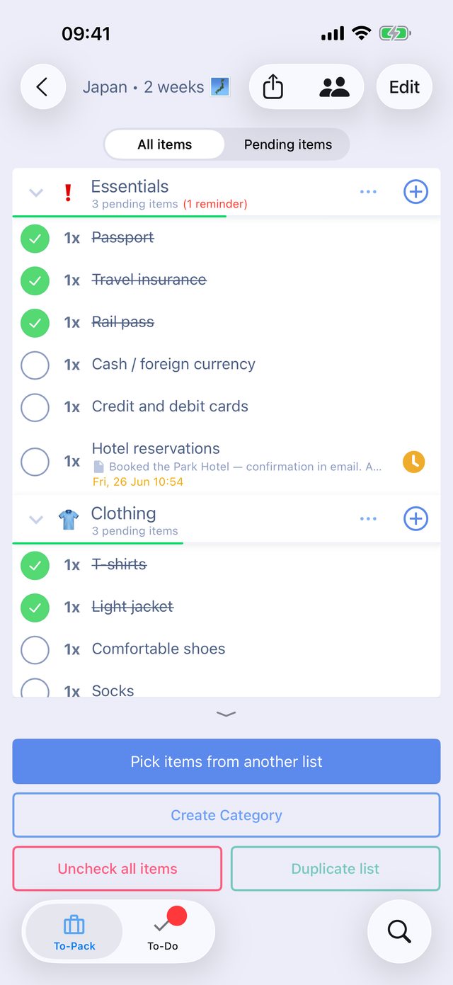 A packing list for a two-week trip to Japan in the app: Essentials and Clothing categories with items checked off